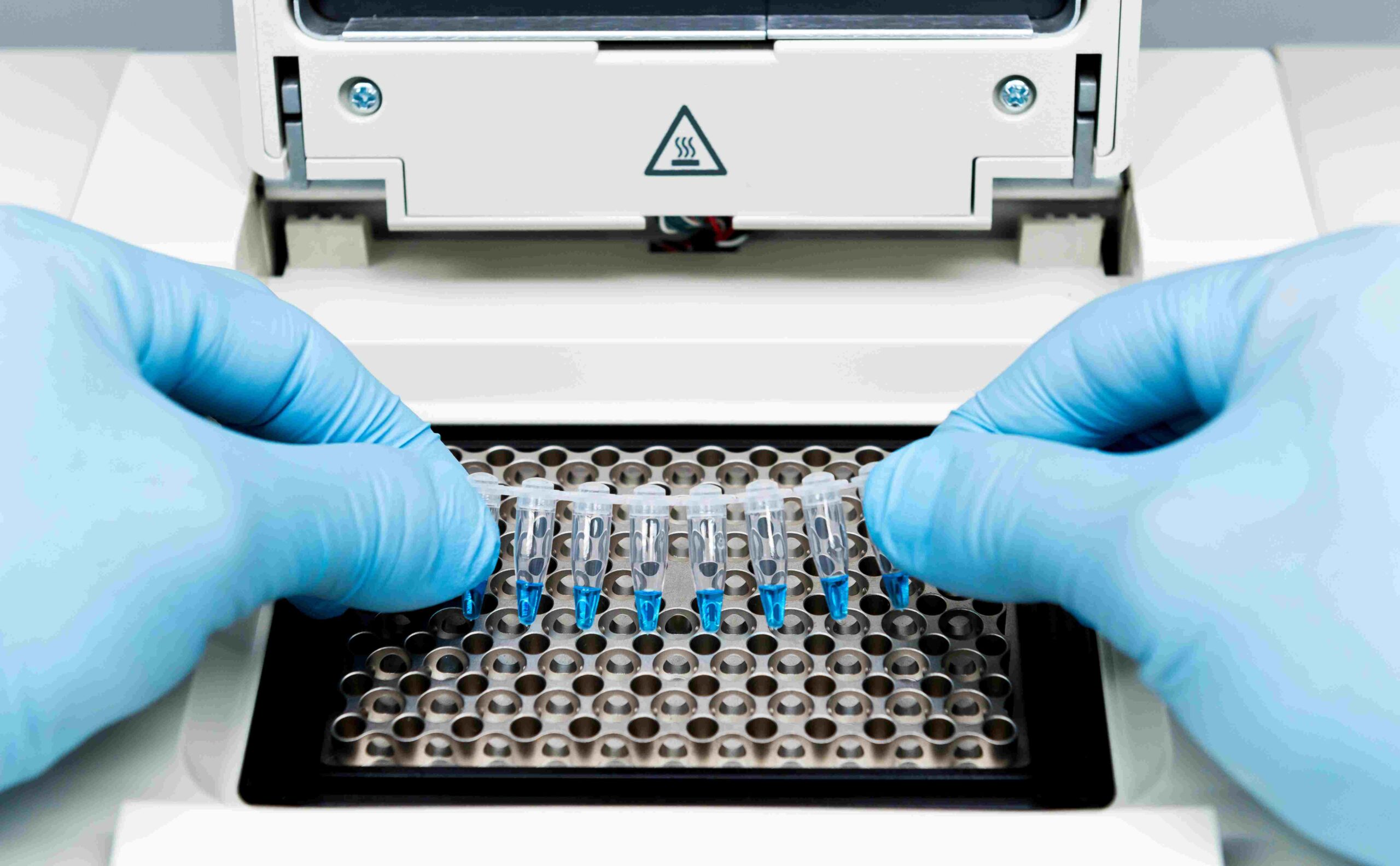 Scientist performing qPCR analysis for quality control of biopharmaceuticals